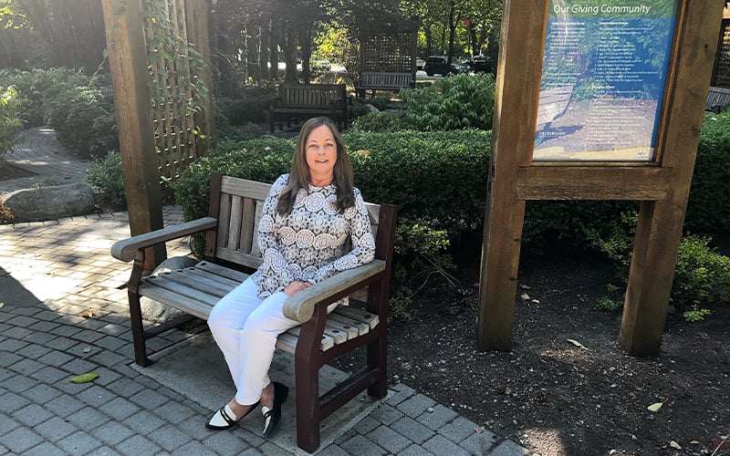 Diana sitting on a bench